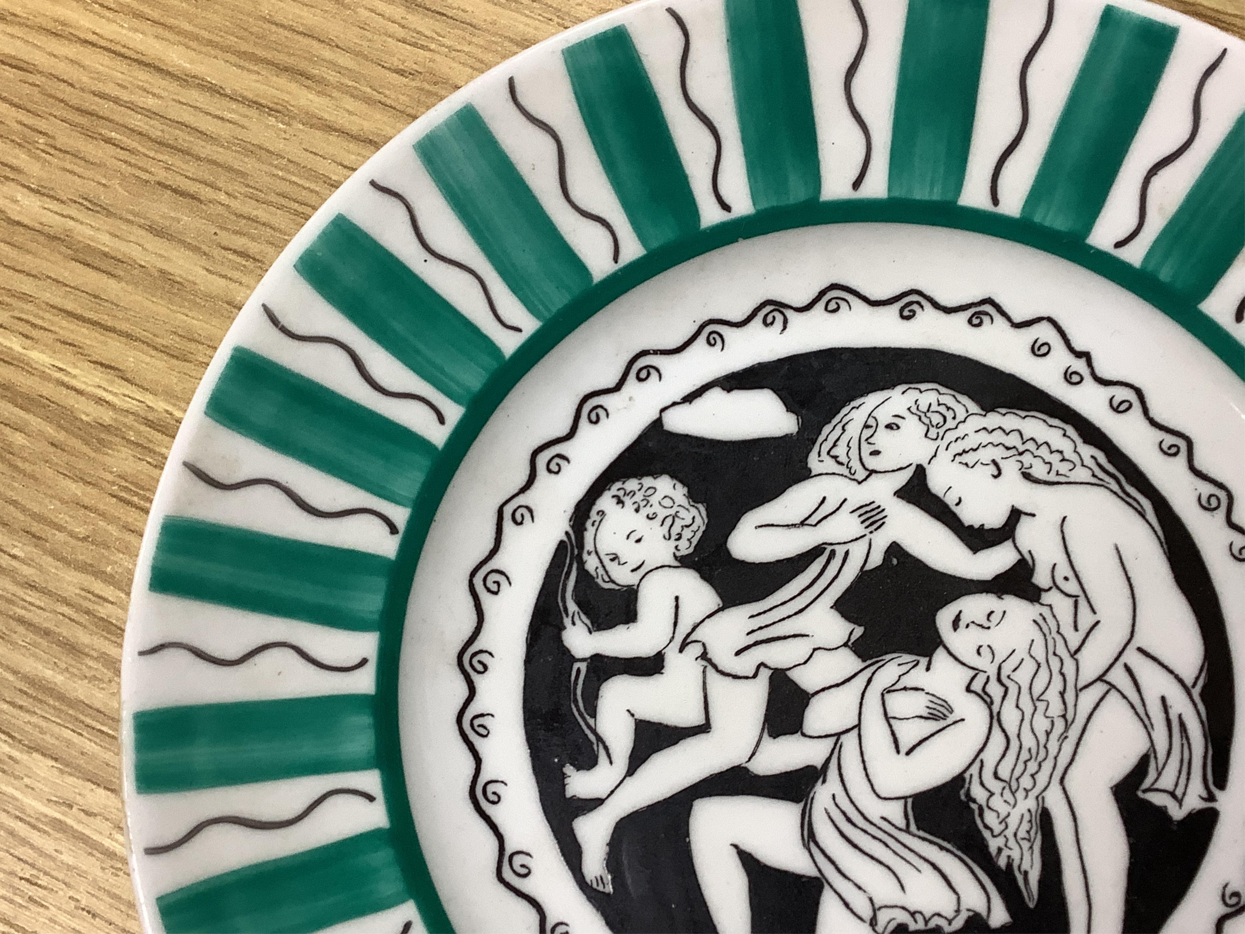 Laura Knight for Foley China cupid plate and matching side plate, together with a Graham Sutherland for Foley China plate and matching side plate, largest 23cm in diameter